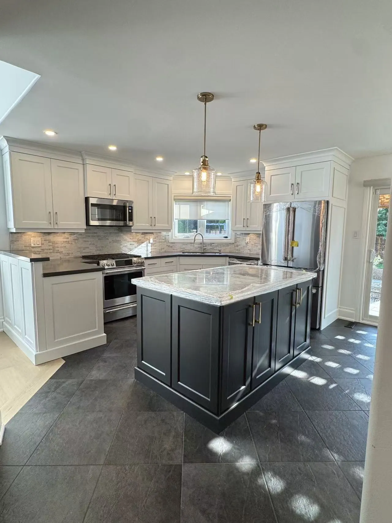 After — cream and brown repainted Oxford White and Onyx — Aurora Highlands, Aurora