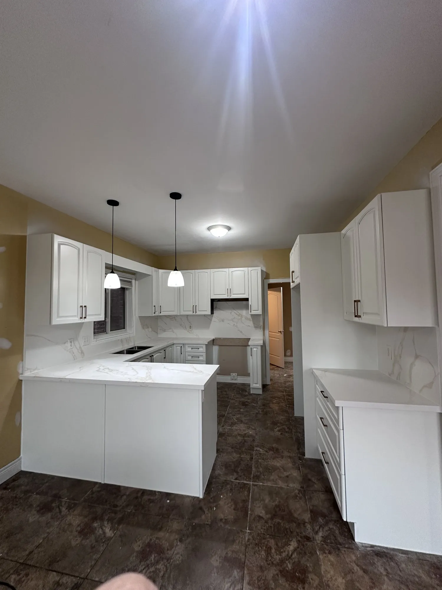 After — dark cherry sprayed white, new knobs and handles — Jerome, Hamilton