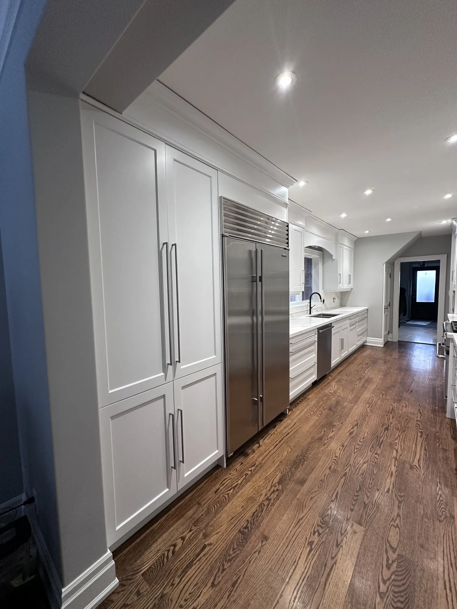 After — dark espresso kitchen and vanity sprayed Balboa Mist — Lawrence Park South, Toronto