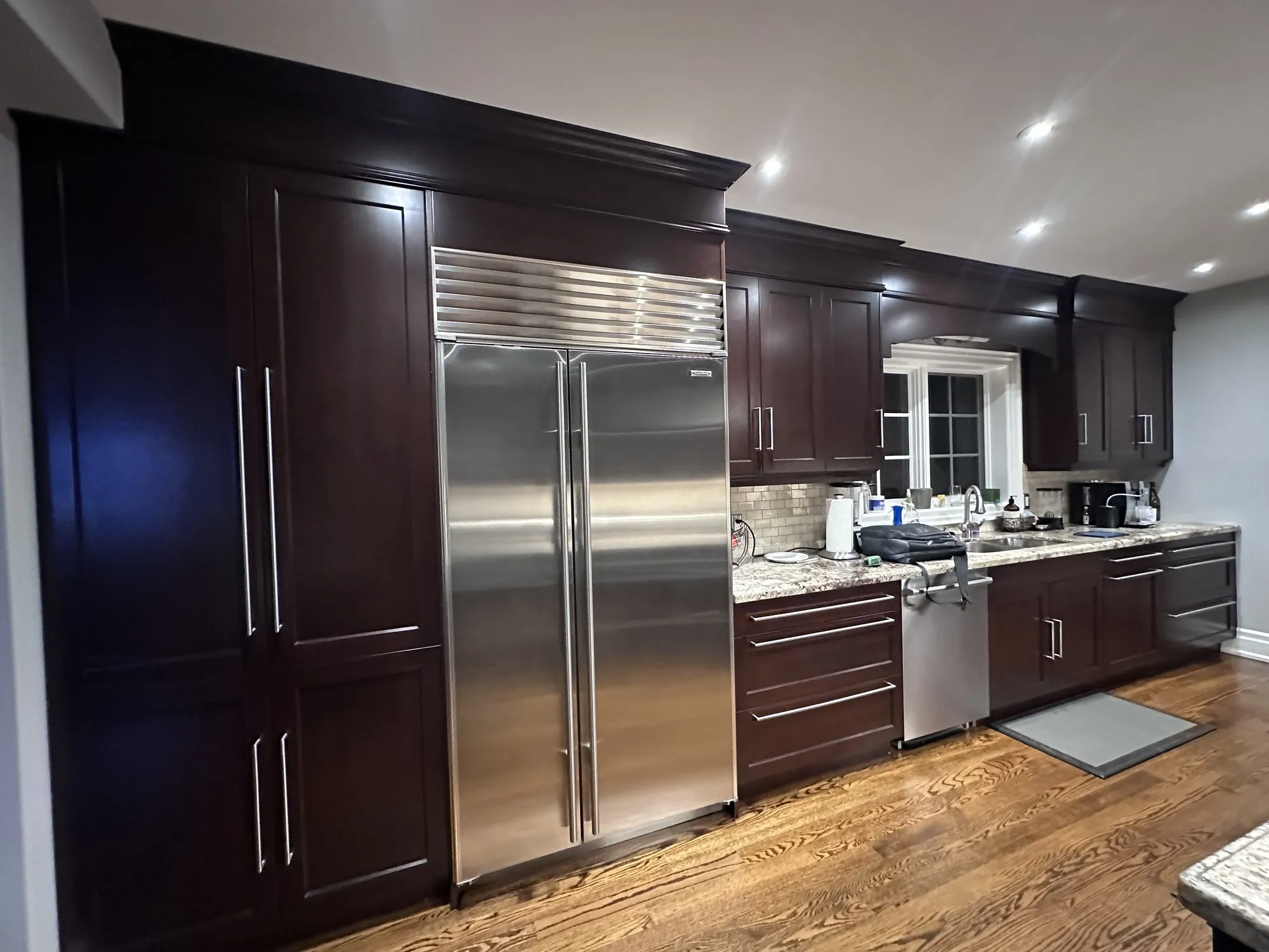 Before — dark espresso kitchen and vanity sprayed Balboa Mist — Lawrence Park South, Toronto