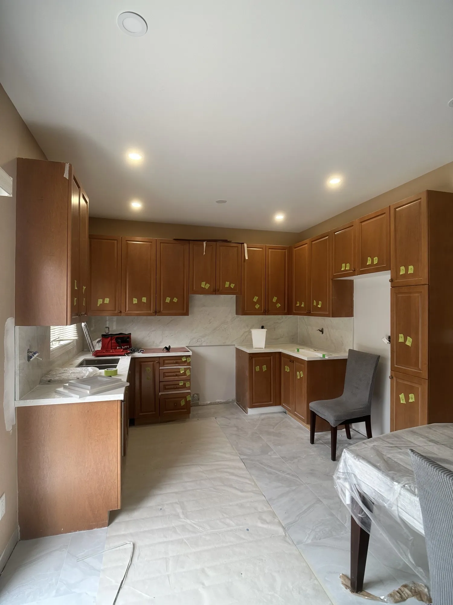 Before — oak sprayed Platinum Gray, crown moulding added, matte black handles — Vellore Village, Vaughan