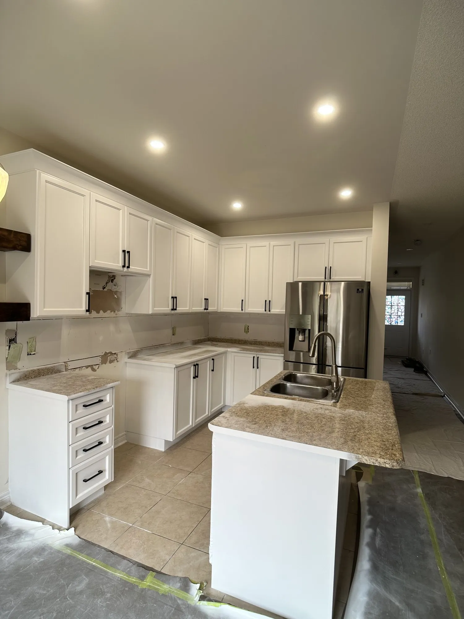 After — walnut refinished white, crown moulding added, granite kept — Churchill Meadows, Mississauga