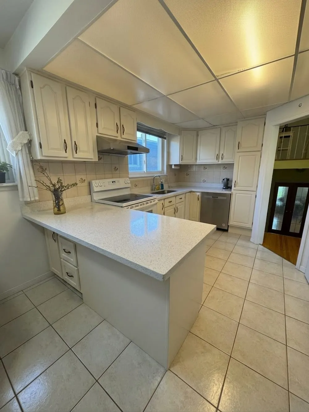 A preview generated by this tool showing the same kitchen with white cabinets