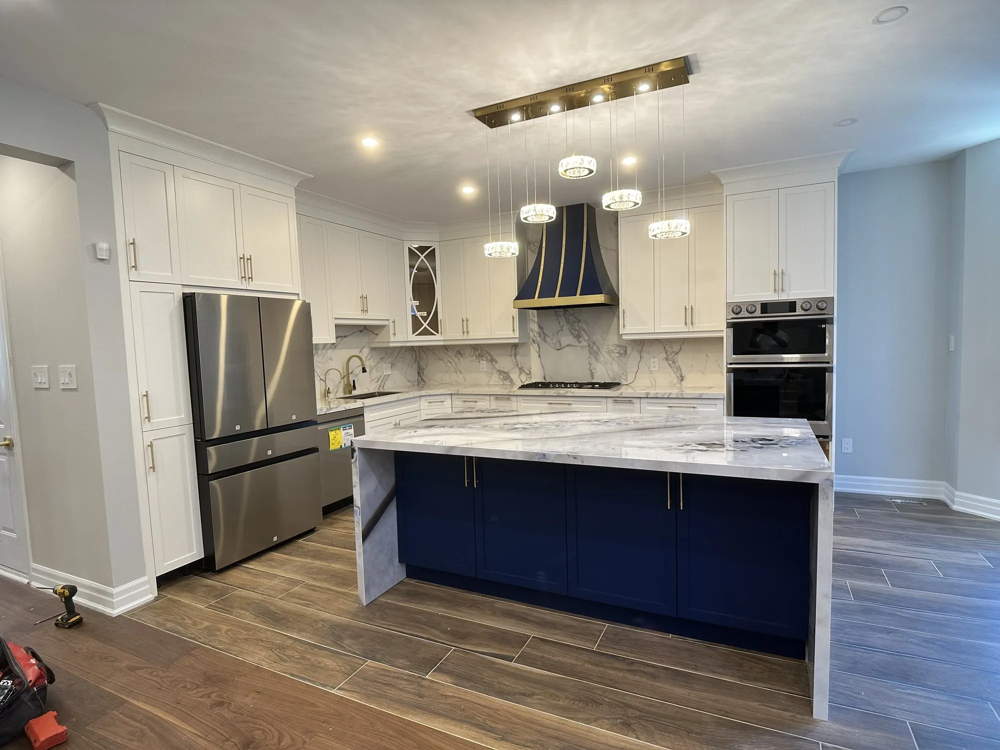 After — custom two tone kitchen built and fitted, white with a navy island — Vellore Village, Vaughan