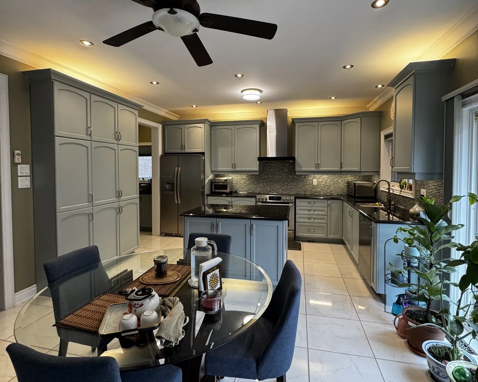 After — dark cherry sprayed Boothbay Gray, island extended with new cabinets, brushed nickel pulls — Jefferson, Richmond Hill
