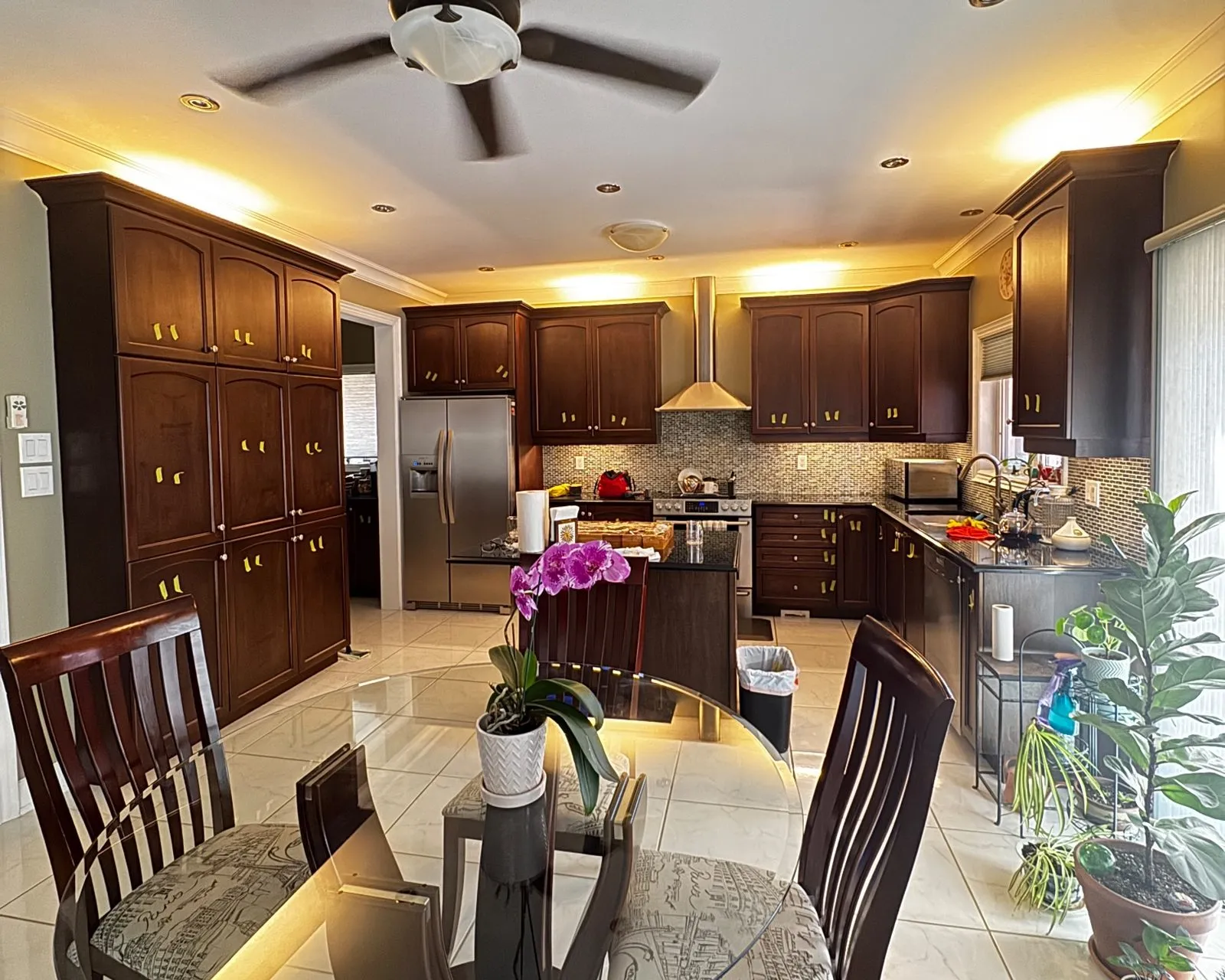 Before — dark cherry sprayed Boothbay Gray, island extended with new cabinets, brushed nickel pulls in Jefferson, Richmond Hill