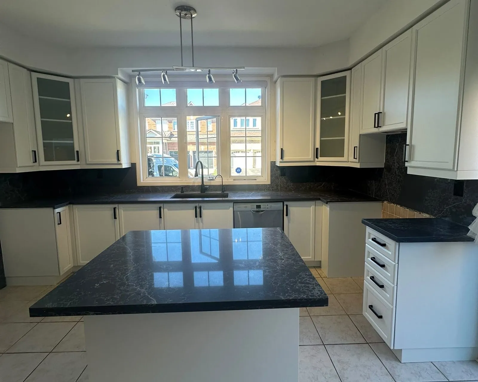 After — dark cherry sprayed Oxford White, matte black bar pulls, new dark countertops and backsplash arranged — Wismer, Markham