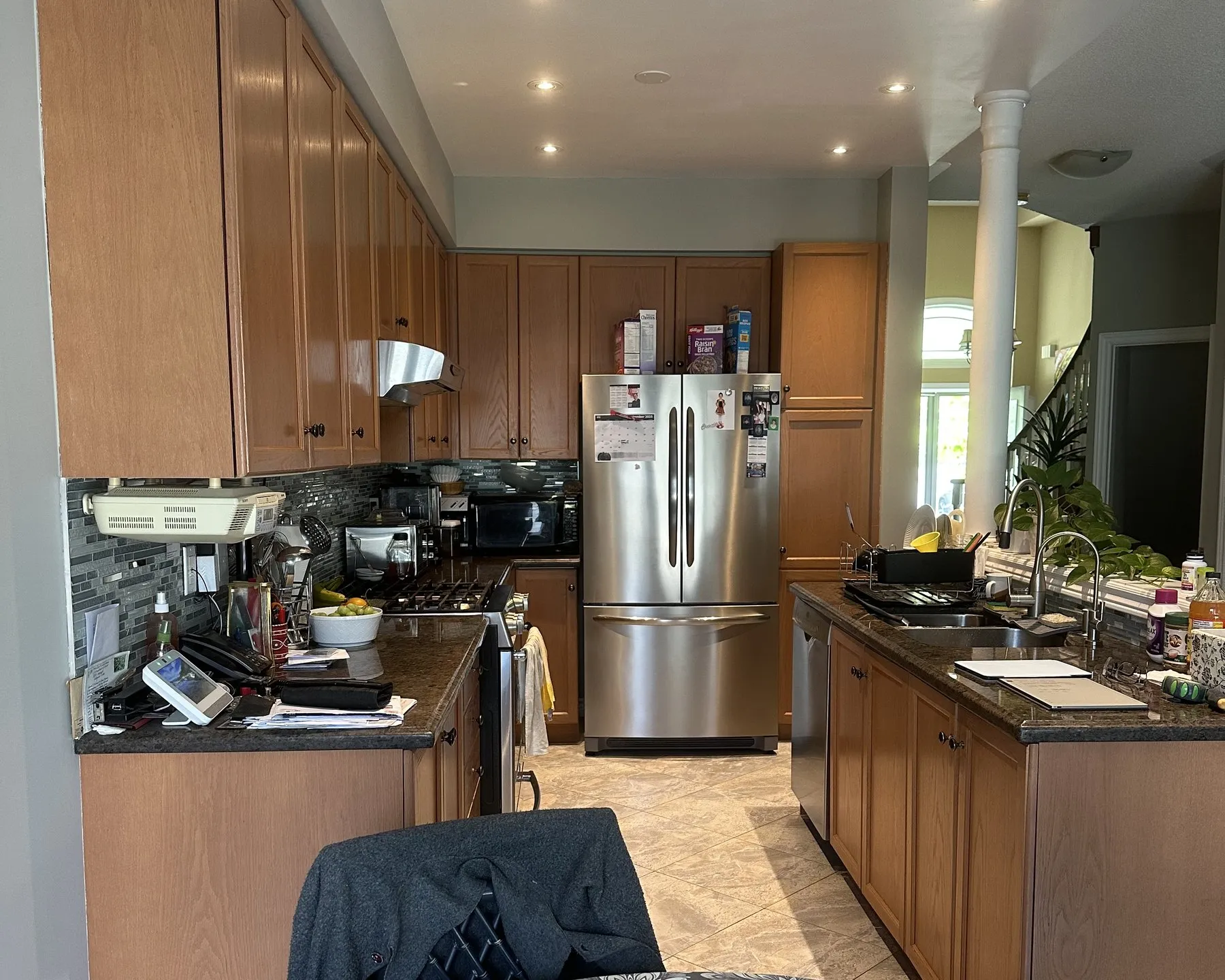 Before — oak to two-tone shaker, new quartz — Bronte, Oakville