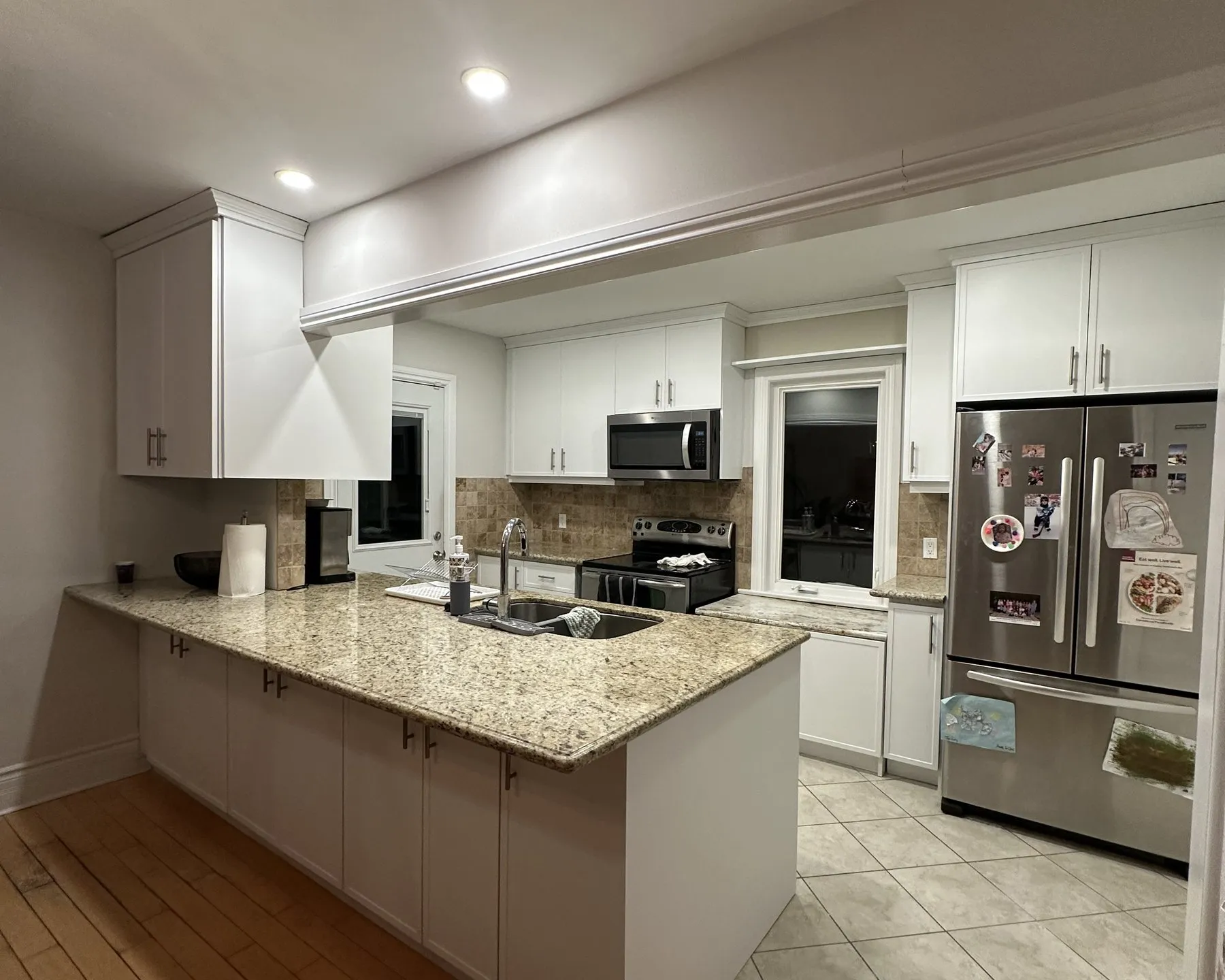 After — espresso to white shaker, granite kept — College Park, Oakville