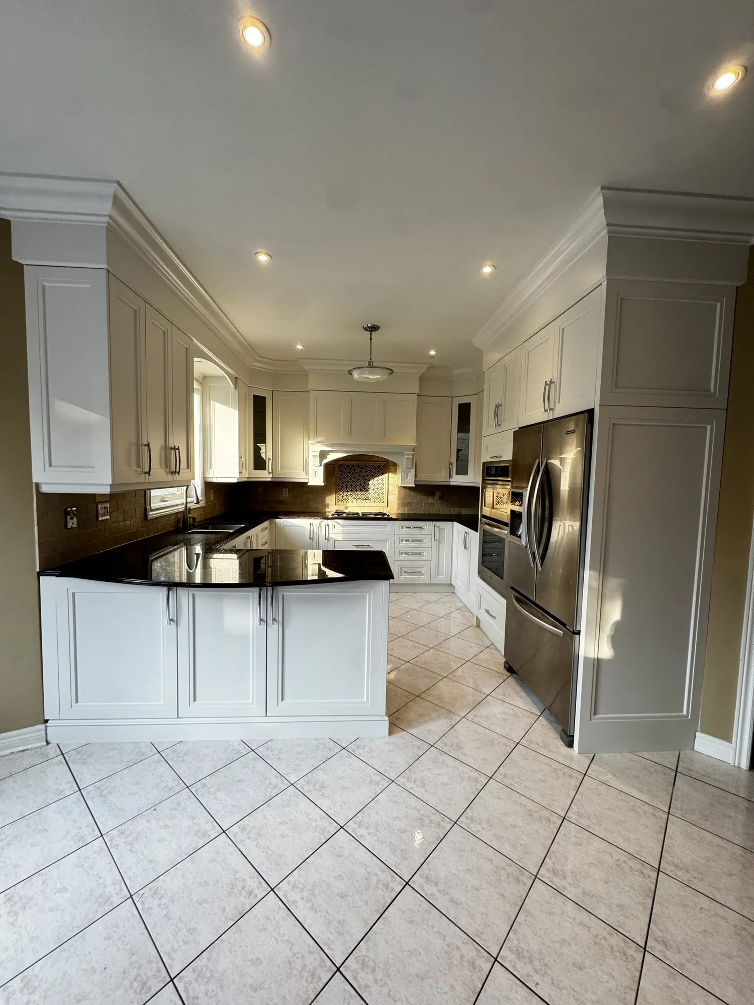 After — uppers repainted, new lower doors cut to match — Joshua Creek, Oakville