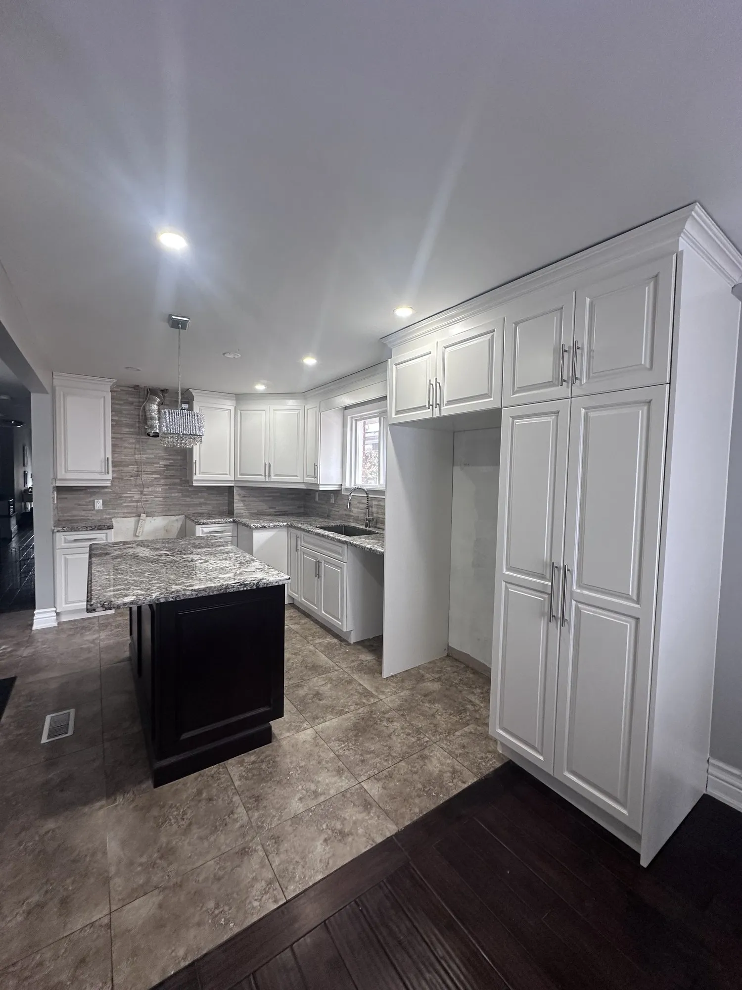 After — perimeter sprayed white, the island left as it was — Richview, Etobicoke