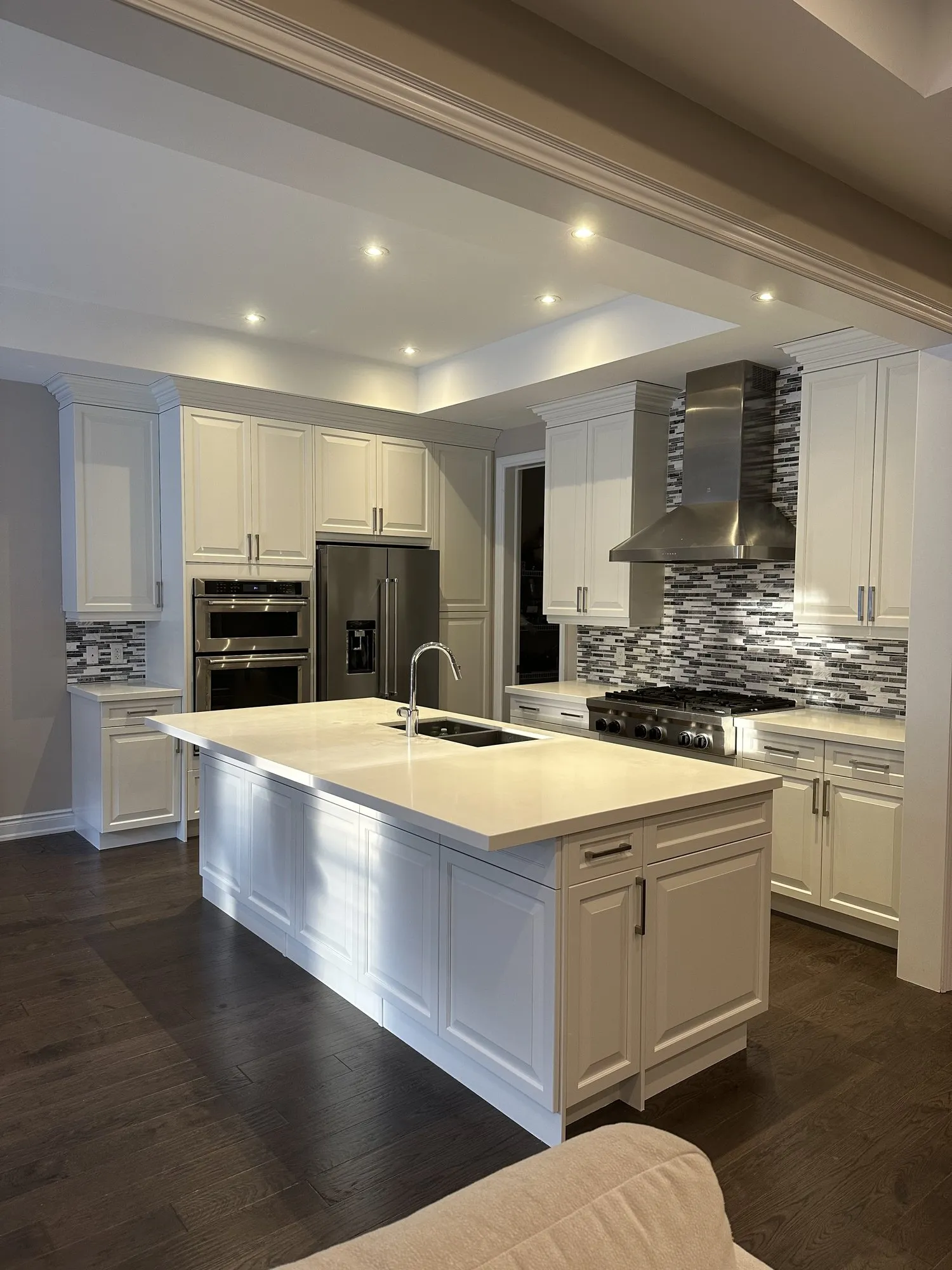 After — dark espresso sprayed one tone white, quartz and backsplash kept — Glenorchy, Oakville
