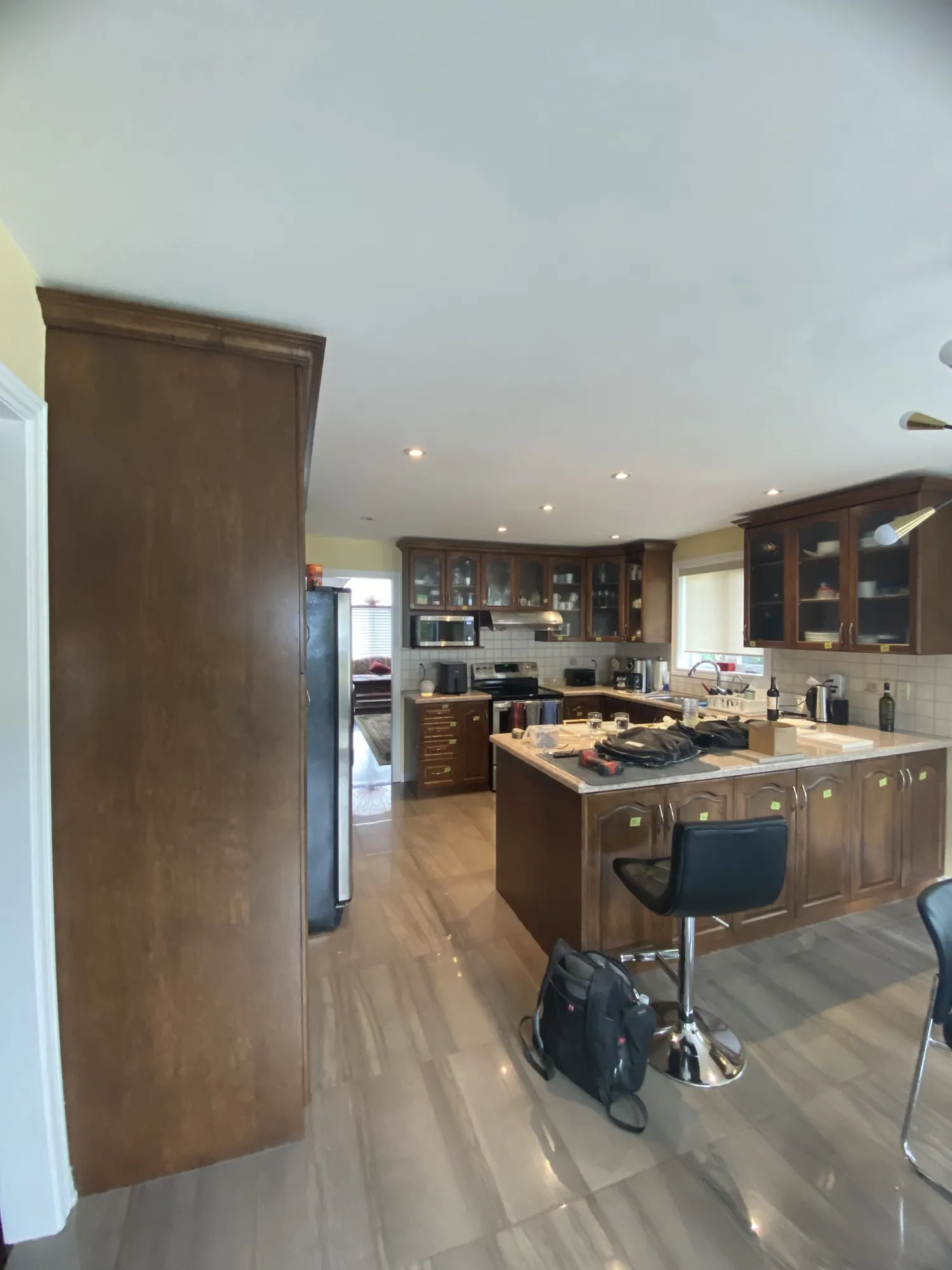 Before — walnut refinished white, nine glass doors replaced with solid MDF — Rouge Woods, Richmond Hill