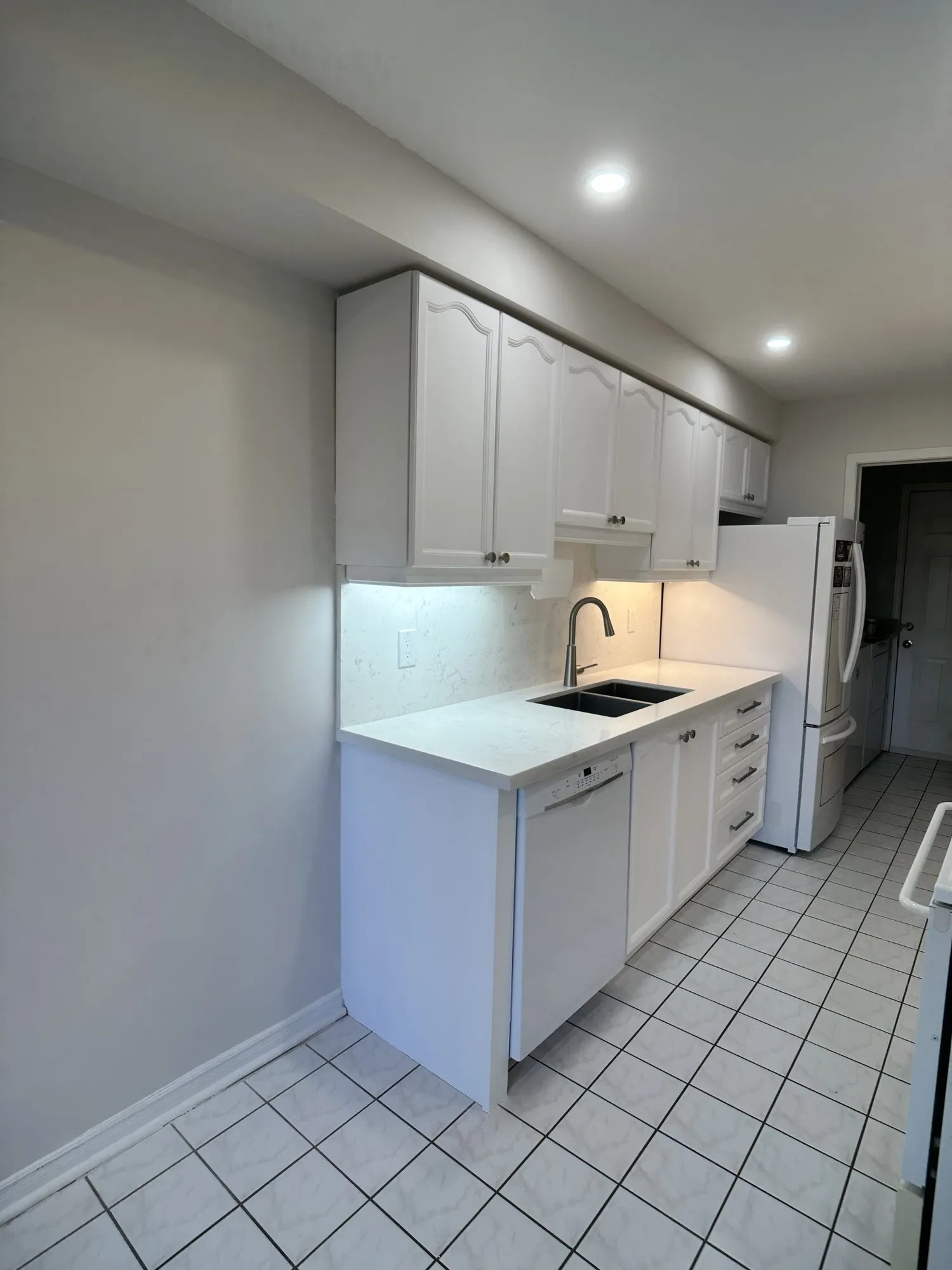 After — oak refinished pure white, seven new soft-close drawers built to the contents — Bayview Wellington, Aurora