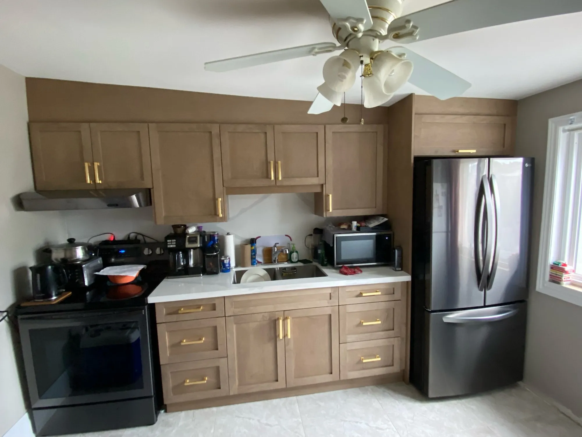After — new stained kitchen built to a floor plan, fitted under a sloping ceiling — Weston-Pellam Park, Toronto